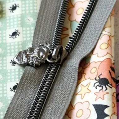 Four Flowered Skull Zipper Pulls